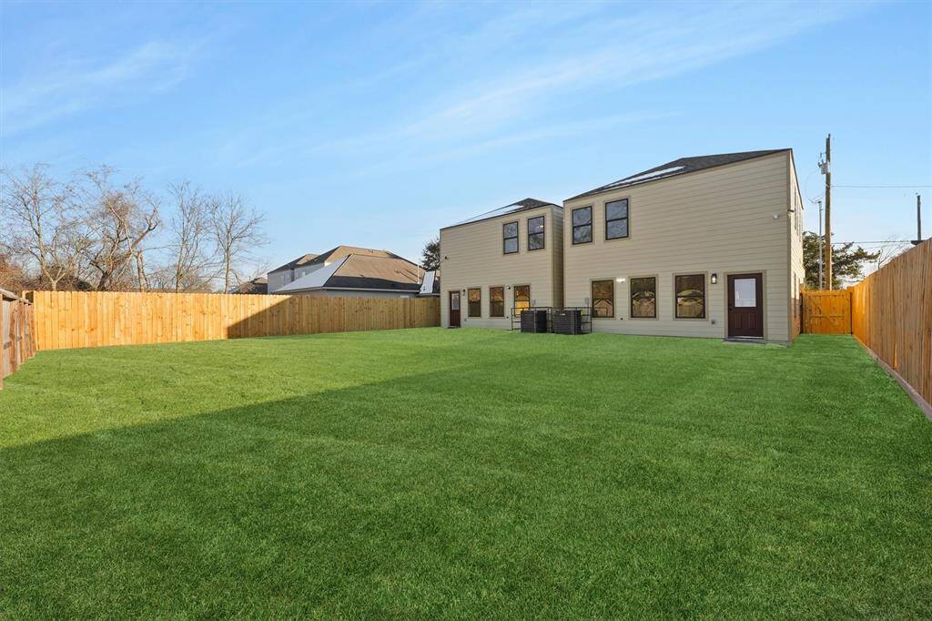 Driving fence is built, splitting the backyards