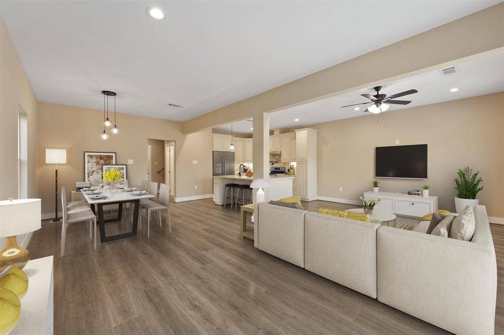 Spacious open floor plan where expansive living area seamlessly flows into the kitchen, creating a perfect space for both relaxing and entertaing.