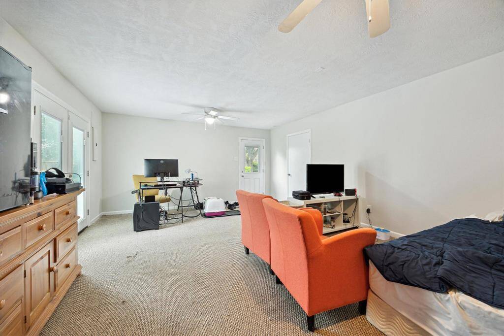 Pool room behind the garage could be transformed into so many things or used as a guest suite.