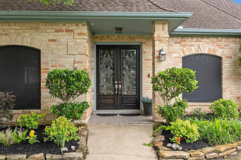 Beautiful double doors with covered entrance