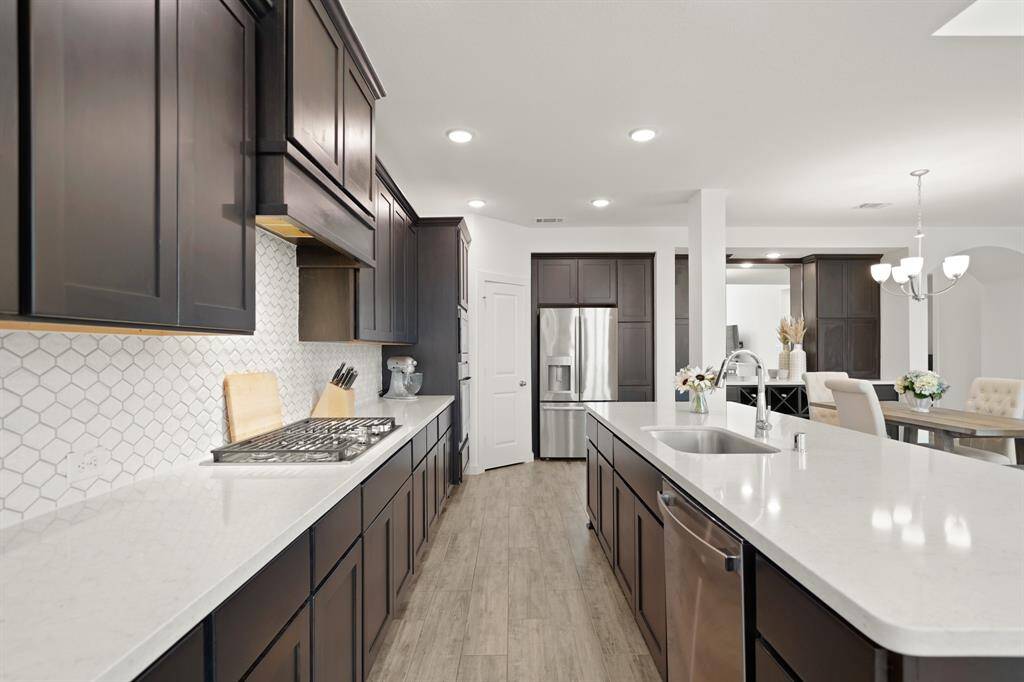 An abundance of counter, cabinet & soft-close drawers along with built-in & walk-in pantries is included.