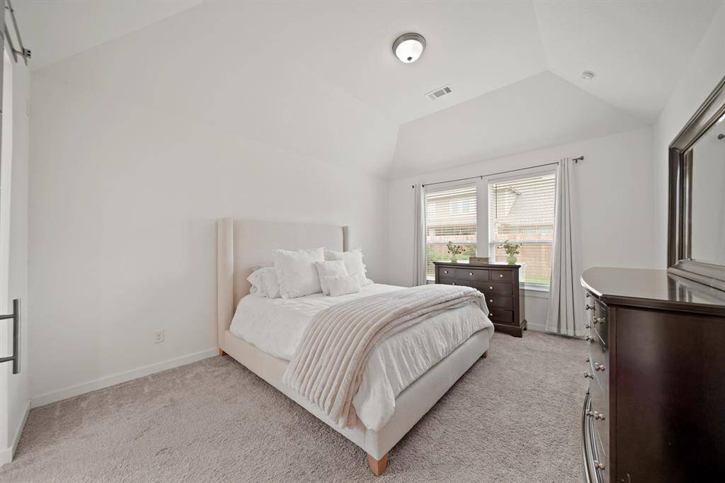 Tucked away on the back of the home is the first floor private owner's suite.