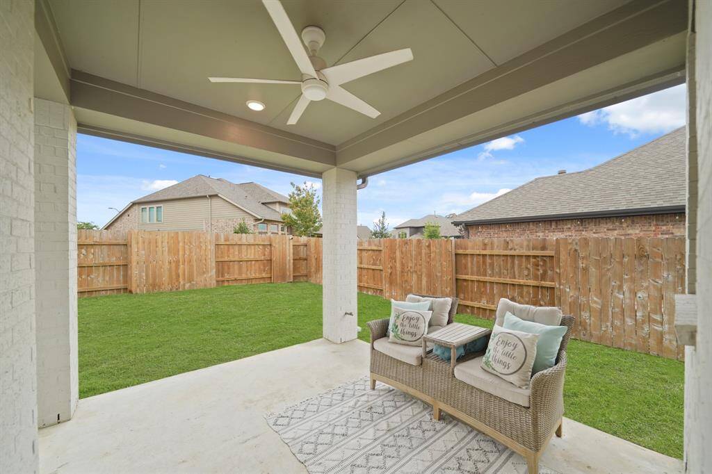 Perfect for outdoor dining & entertaining, this covered patio has recessed lighting, a ceiling fan with light fixture and a natural gas line for a barbecue grill.