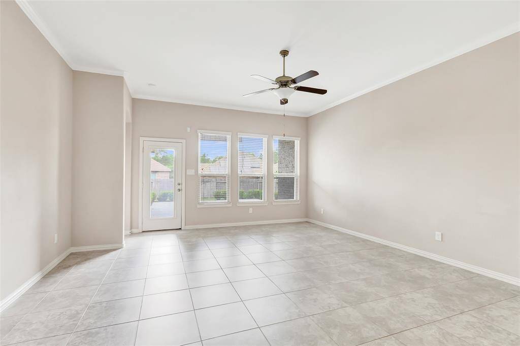 Family room with wall of window to the back yard.