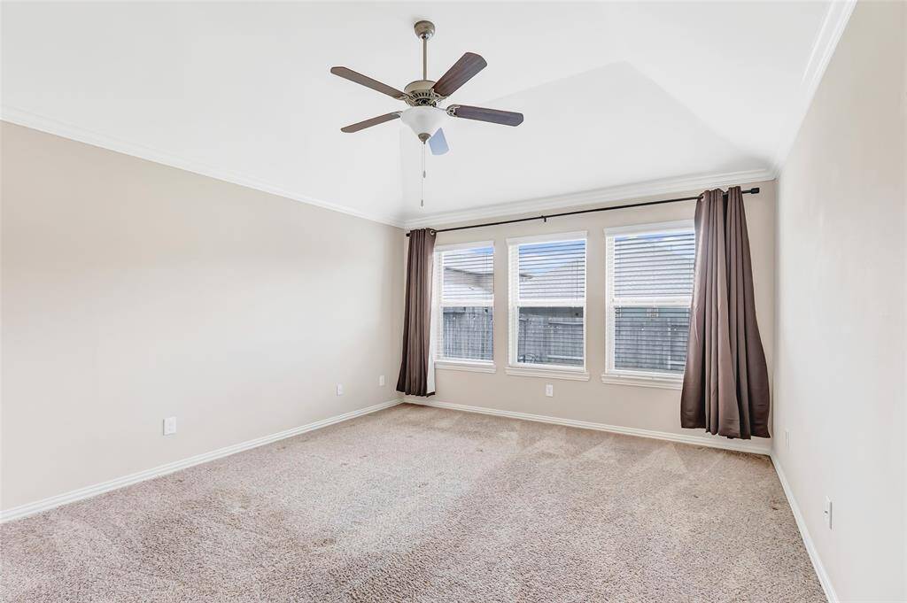 Owner's retreat with triple windows for back yard view.