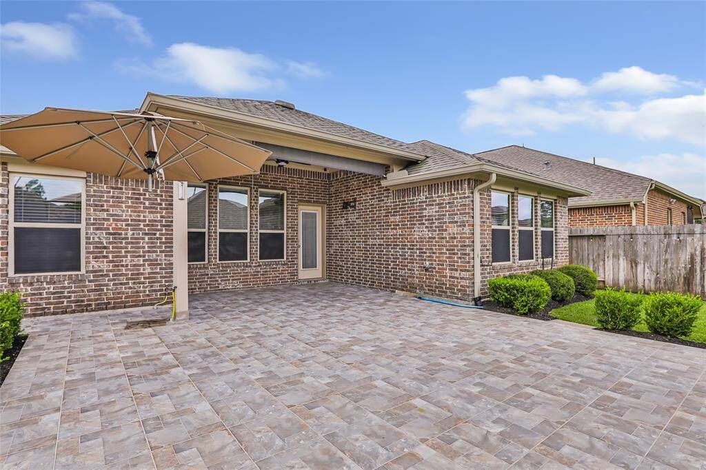 Head straight to the back yard with this 24x24 tile patio! Roll down shade plus umbrella to help with the heat during those scorching summers! Gas plumbed for outdoor kitchen/grill. This is the entertainment spot for sure!