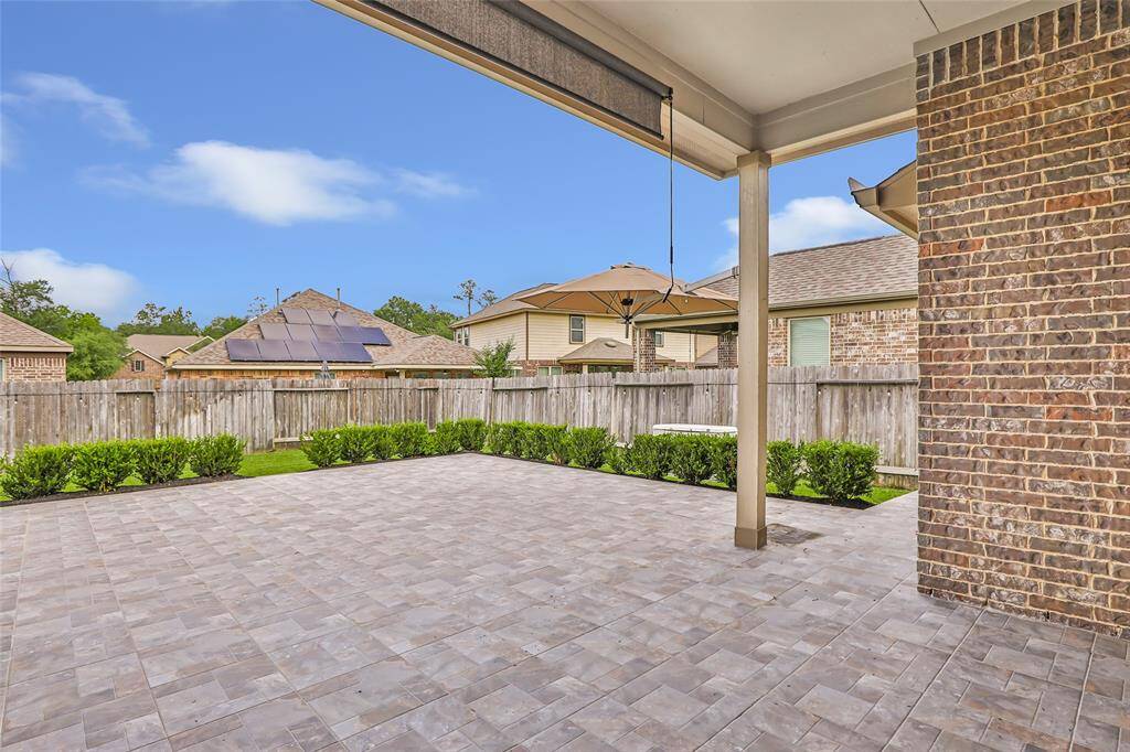 Covered back patio -- all you need is your table/chairs and a grill and you will be chillin and grillin!