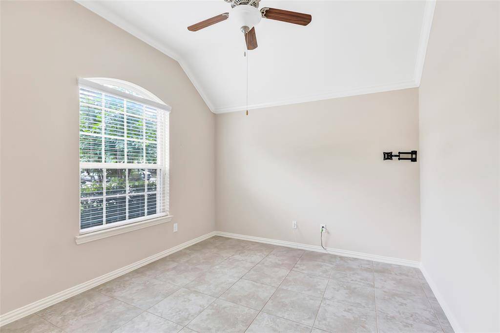 Home office with French doors and front window view is located to the left as you enter the home.