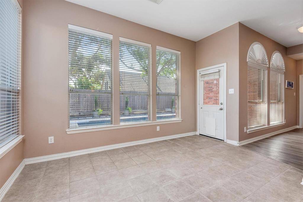 Officially the sunroom area that overlooks the pool in the backyard.
