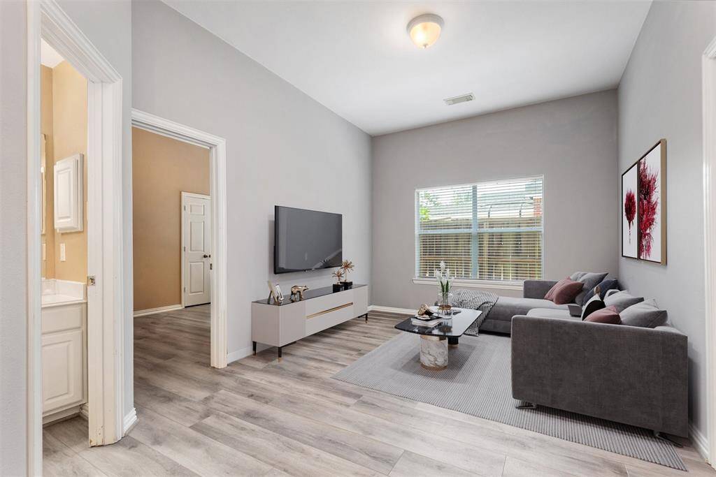 Virtual photo of game room/tv area between the two secondary bedrooms.