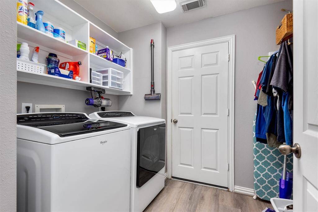 Laundry area off of the garge and secondary bedrooms.