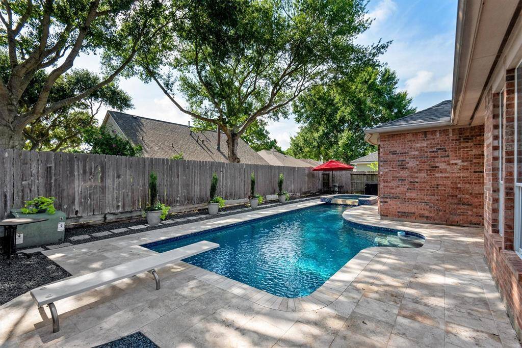 Nice size swimming pool with hot tub.