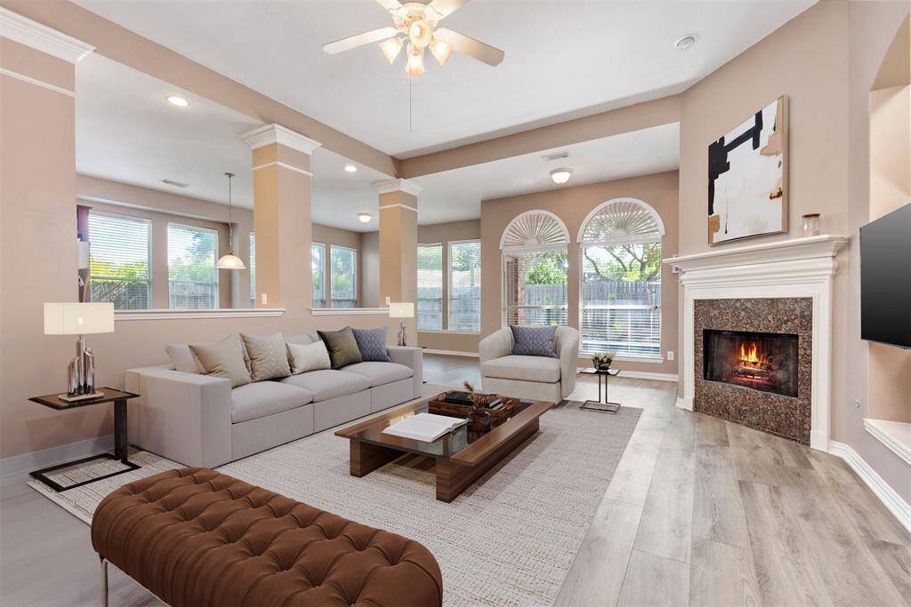 Virtual photo.  Large living room with a gas log fireplace.