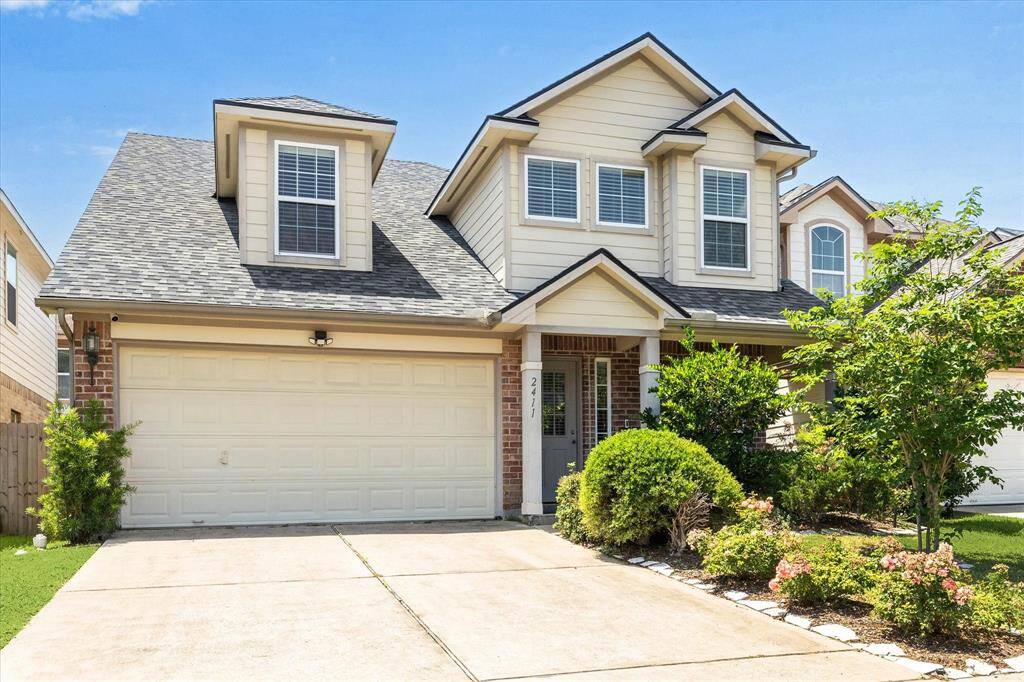 Charming front yard with fresh, vibrant landscaping.
