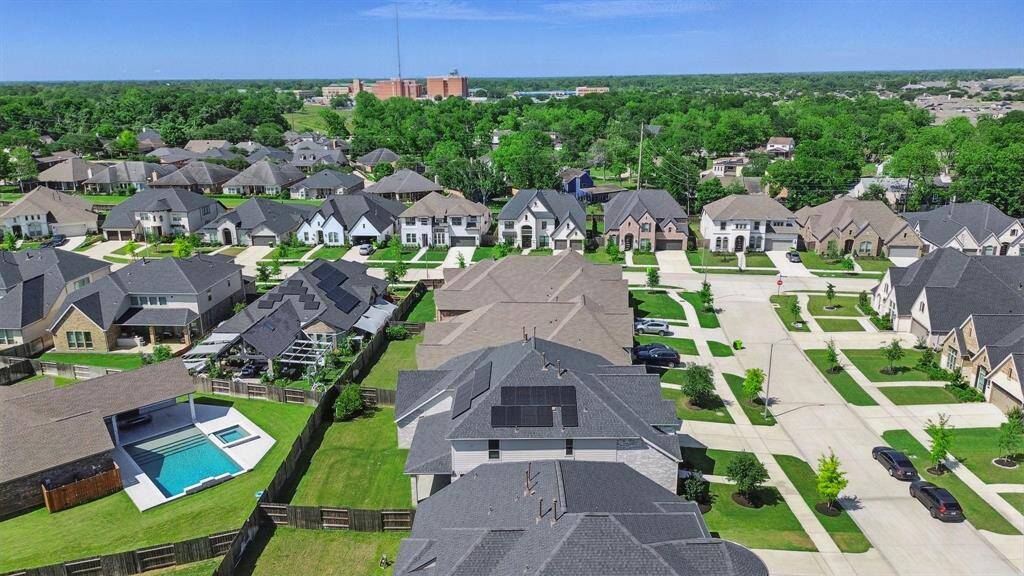Aerial view looking east over the community, showing proximity to nearby homes and walkable streetscapes in a family-friendly setting.