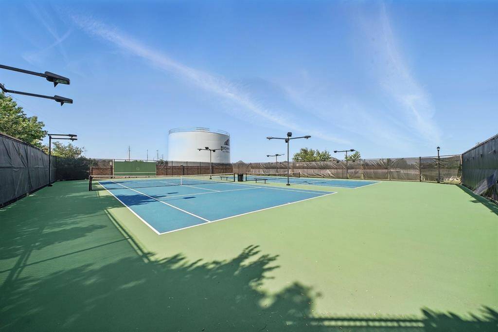 Enjoy an active lifestyle with access to the community’s tennis courts, offering a well-maintained space for daytime and evening matches under the lights.