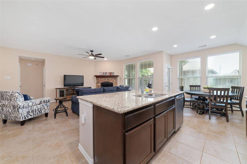 Island kitchen open to the breakfast, living, and dining room.
