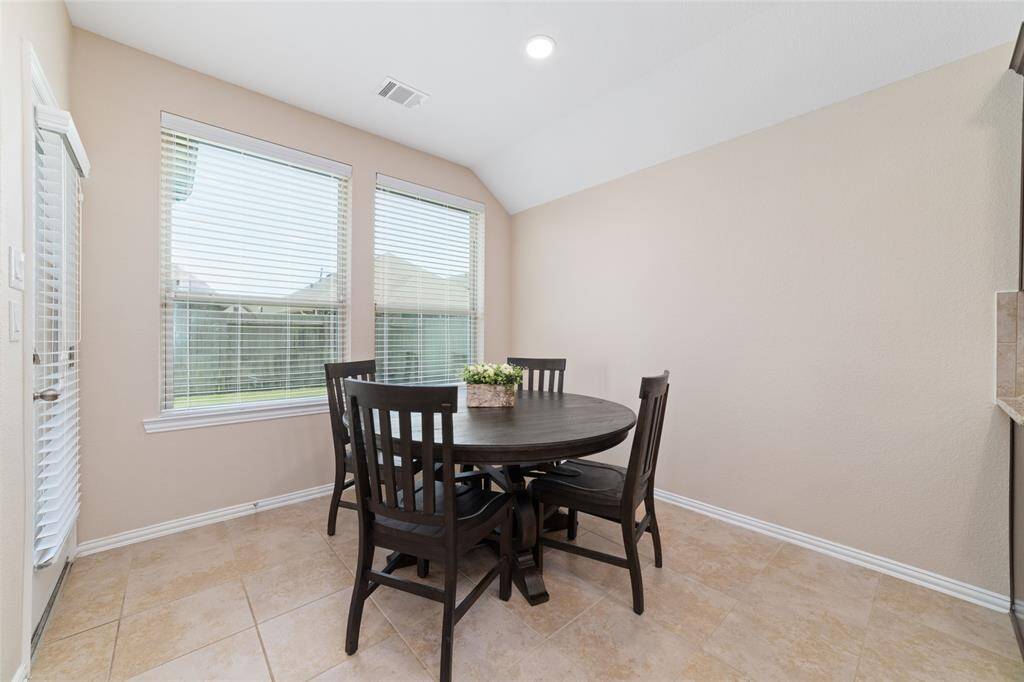 Breakfast room leading out to backyard covered patio.