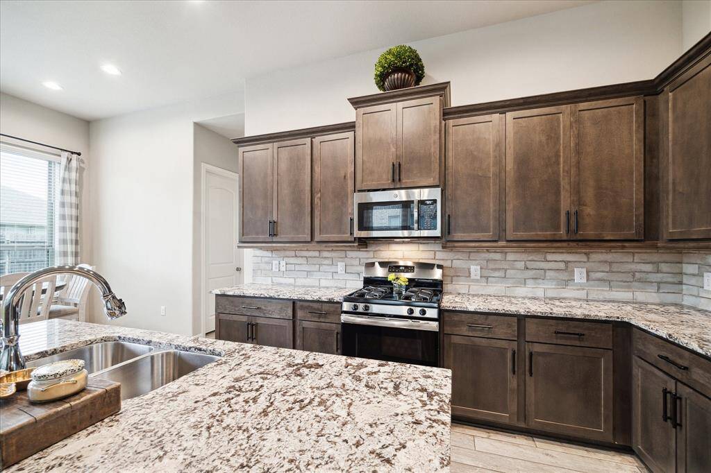 This kitchen provides abundant cabinetry for all those kitchen gadgets. Plenty of space to use those culinary skills to impress your friends and family.