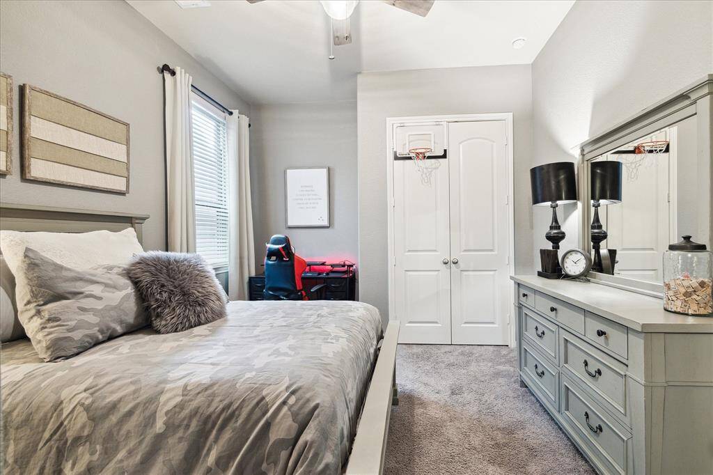 This roomy bedroom features neutral paint with plush carpeting. Your family and guests will rest comfortably!