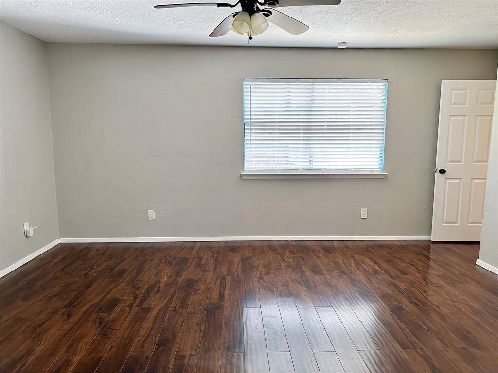 Master bedroom is sizable with large windows for great natural light.