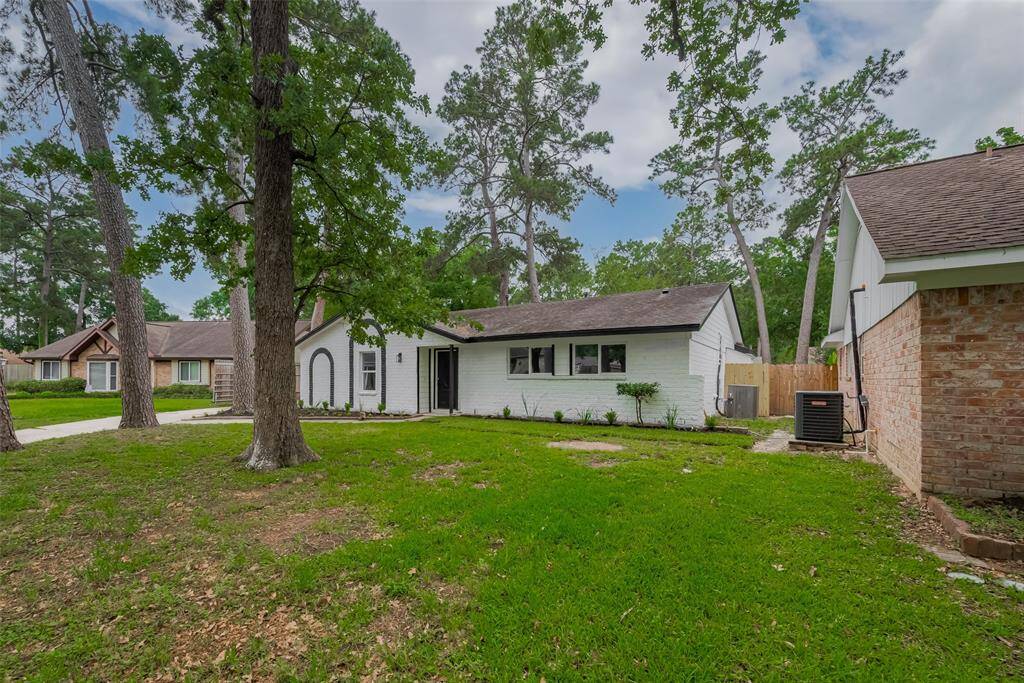 Lovely curb appeal with mature trees.