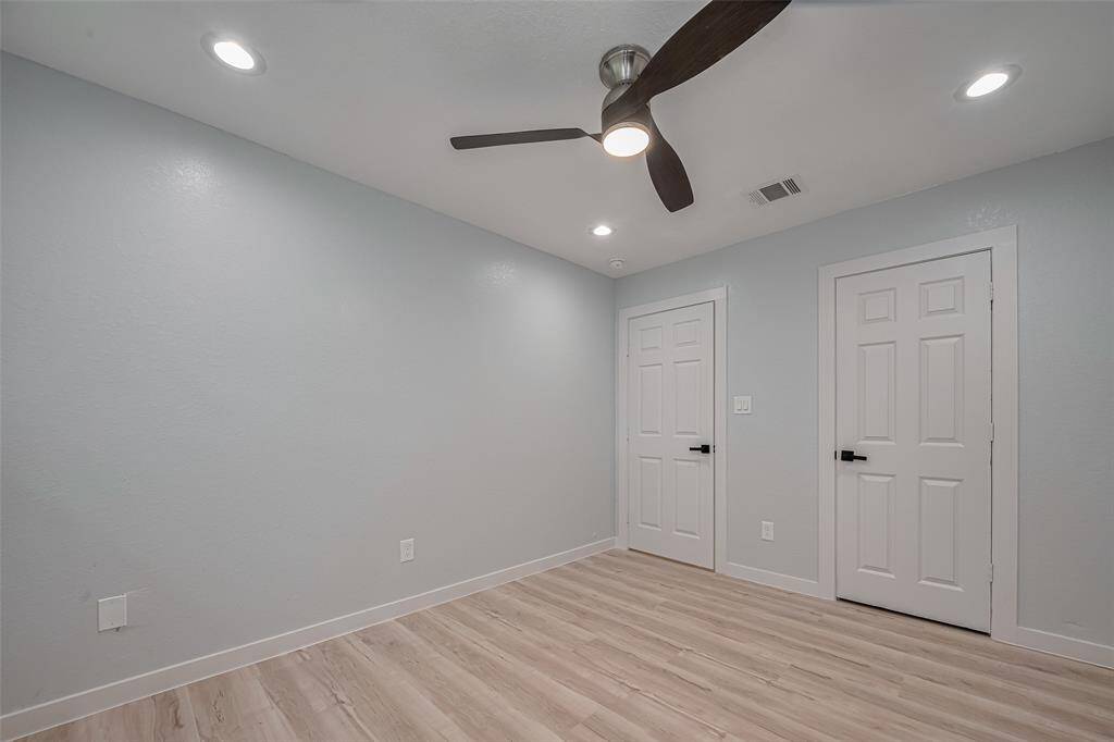 Vinyl flooring and high ceilings throughout the house.