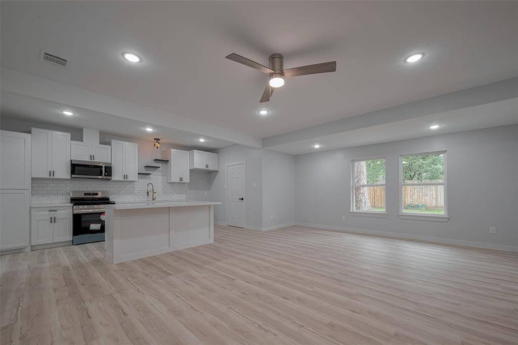 Open concept floor plan with huge windows and lots of natural sun light.