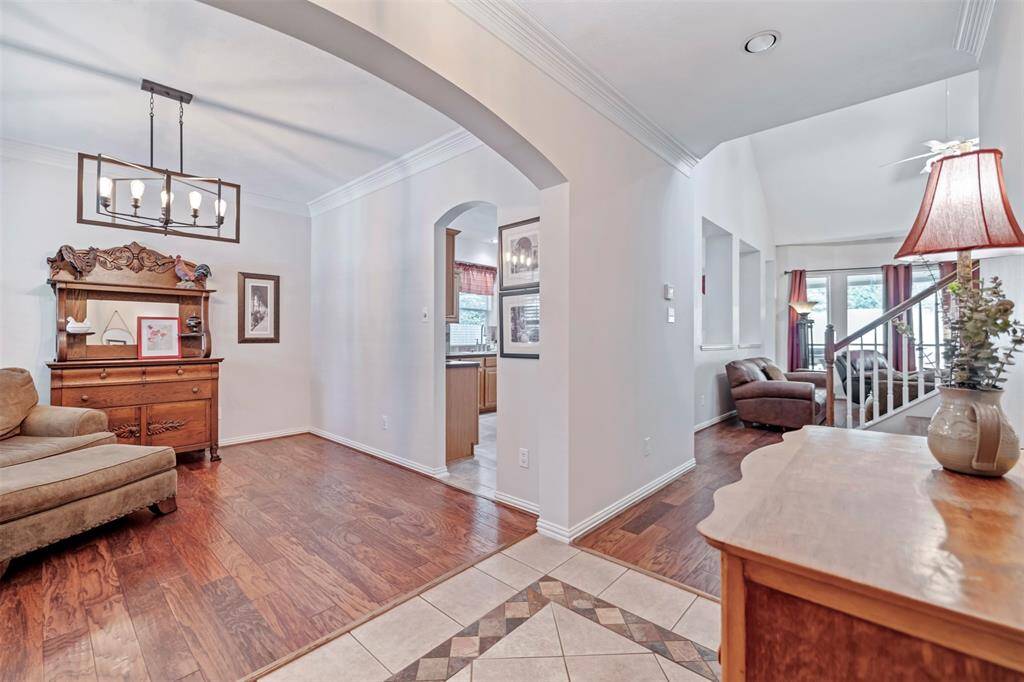 Upon entry, formal dining/flex space to the left