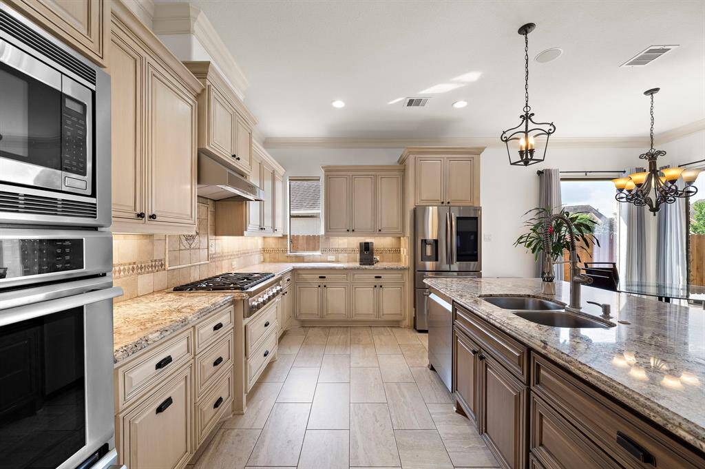 The brand new Thermador gas cooktop is a focal point and visual anchor to the kitchen