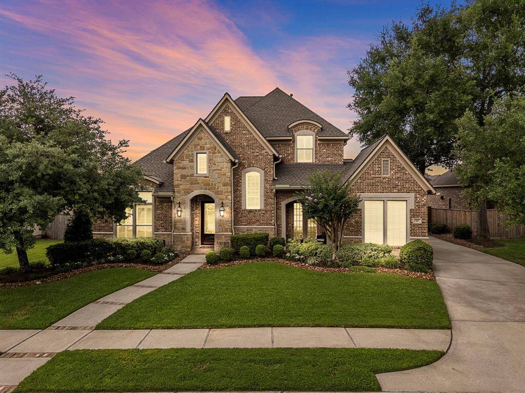 Welcome to your new custom home! Elegant roof lines and thoughtful architecture exude luxury and sophistication. Enjoy the privacy of a motor court at the end of the secluded driveway.