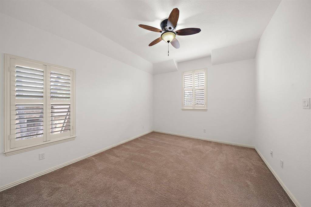 Secondary bedroom with elegant plantation shutters