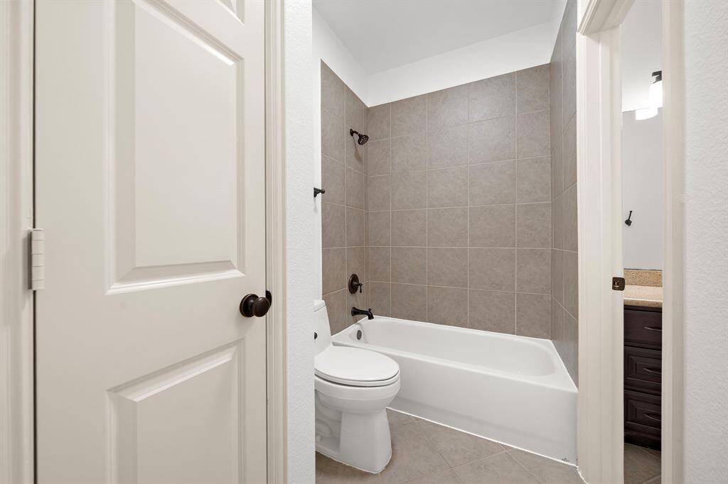 Secondary jack and jill bathroom with crisp, clean lines.