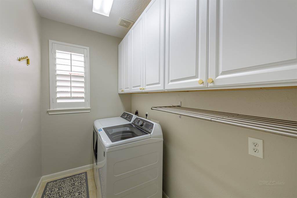 Recently Added Cabinets in this Large Laundry Room