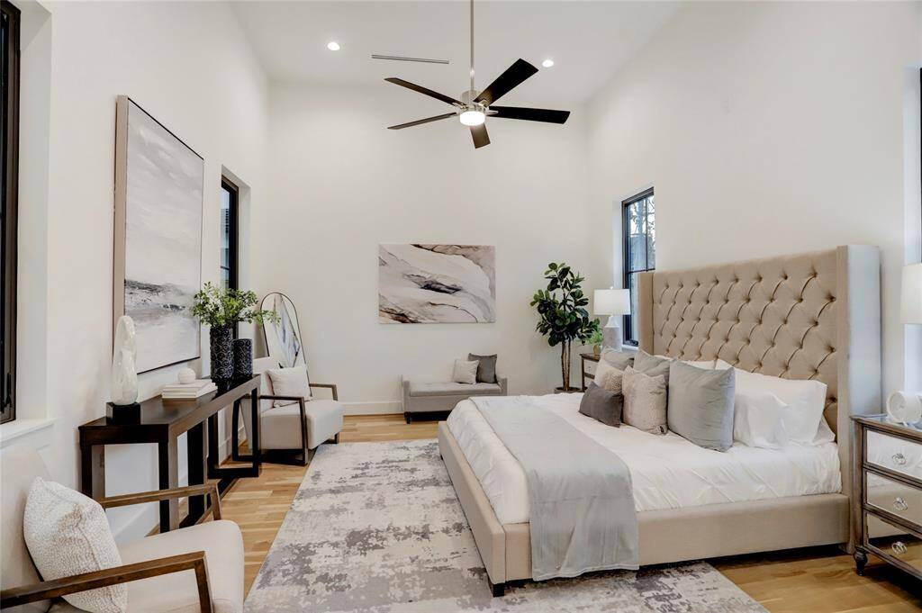 The first-floor primary retreat is situated at the back of house with 14' ceilings and also overlooks the turf courtyard.
