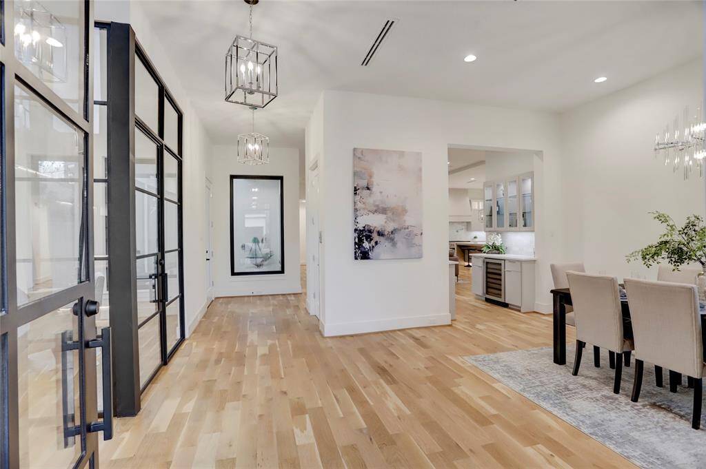 As you enter the home you're greeted by 11' ceilings throughout the first floor and an open floor plan.