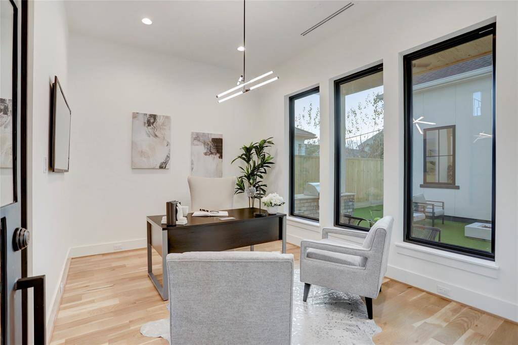 The glass-corner study overlooks the courtyard and was built with the idea that it could be a wine collector's display room if a study wasn't needed.