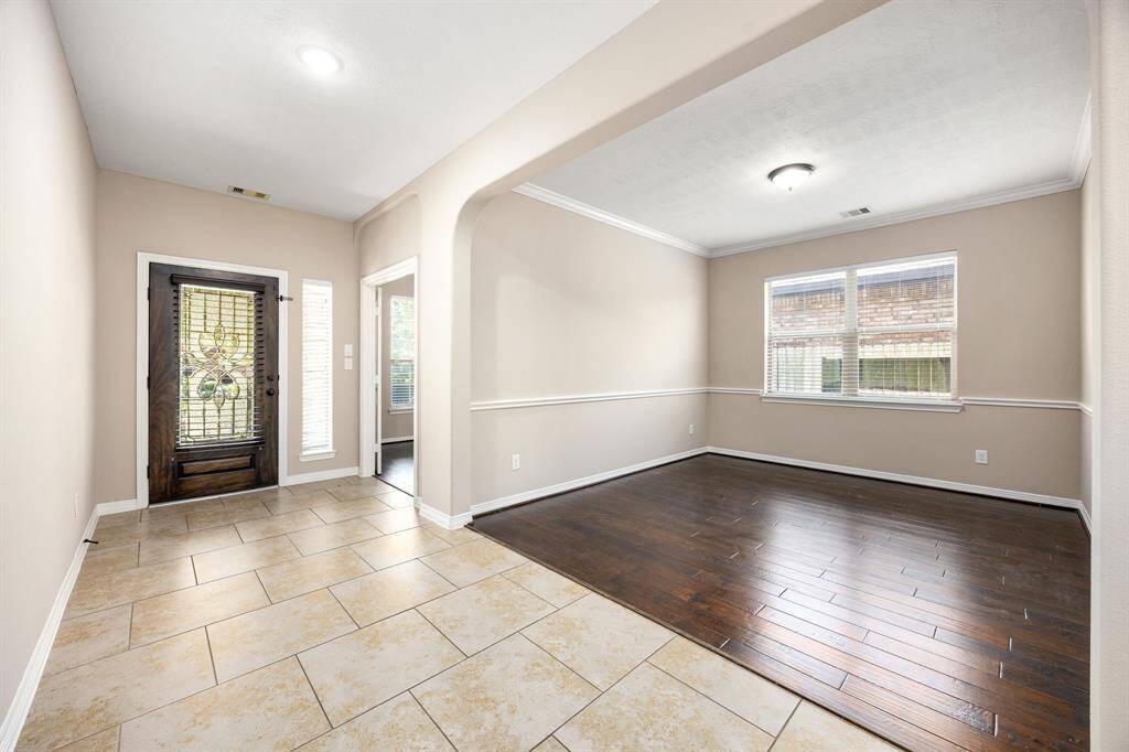 Formal dining space with wood-look vinyl plank flooring. The rounded corners add interest to this space. Imagine a unique light fixture over your dining set.