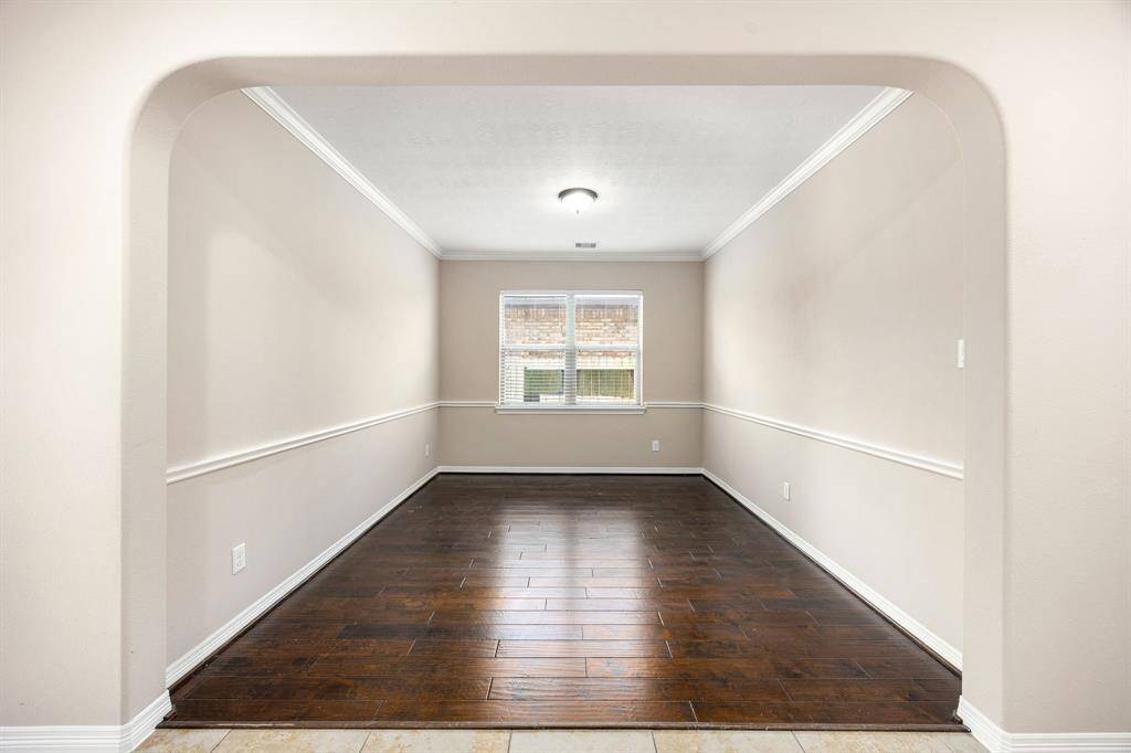 Another view of the formal dining space with accented chair rails.