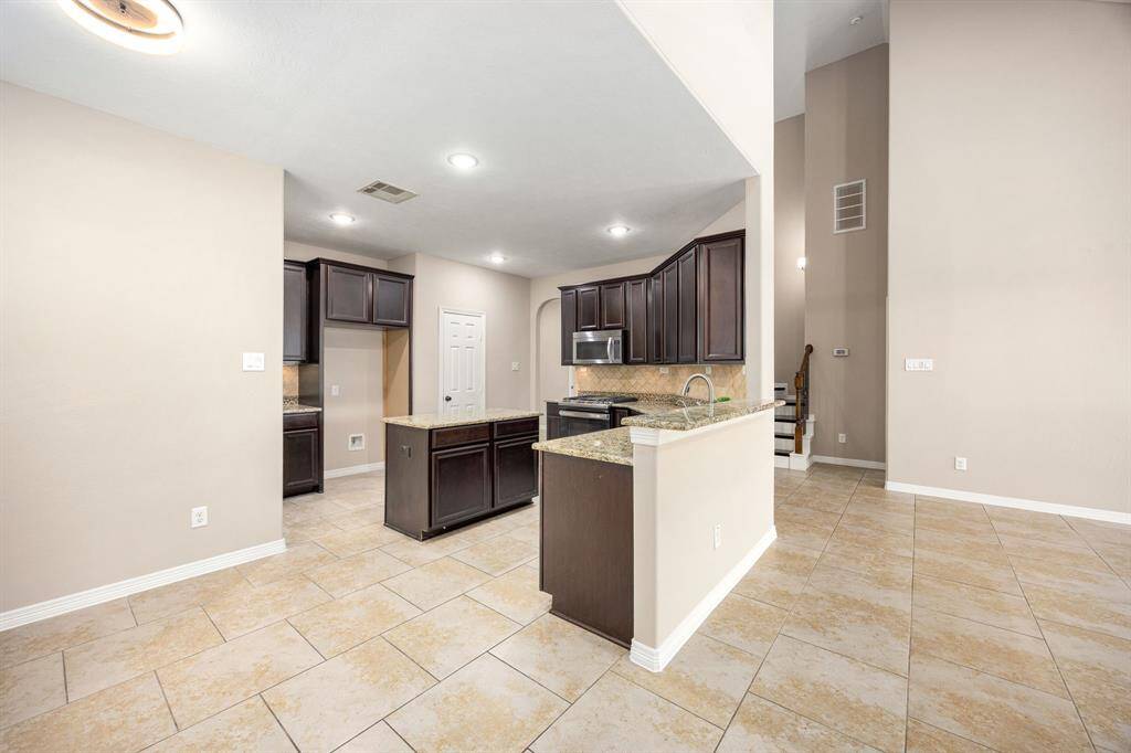 Just off the kitchen is a cozy nook, perfect for your breakfast table.