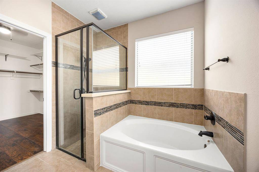 Ensuite has a separate shower and soaking bath tub.