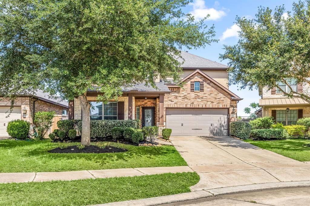 The home is angled on a rounded corner with the benefit of a longer driveway.