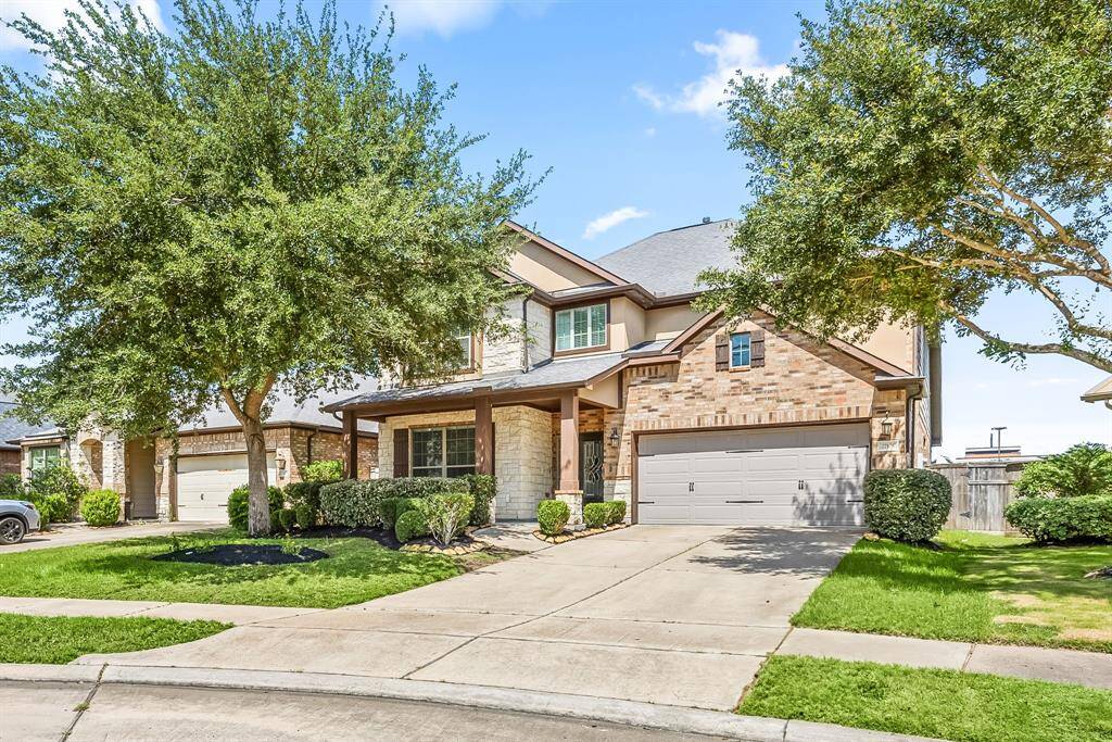 Two-car garage with ample parking.