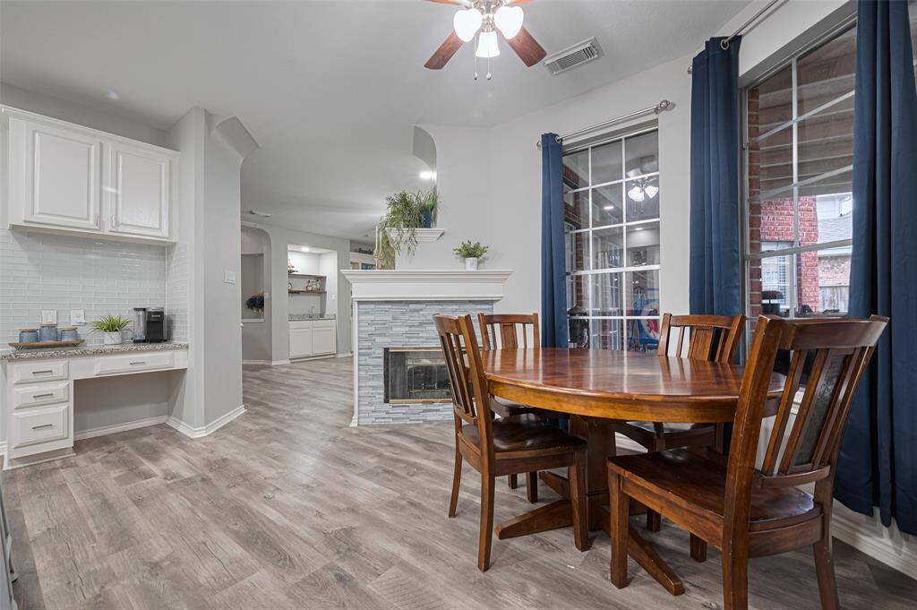 This photo also shows the built-in desk area with drawers and cabinets for extra storage.  This home has oo many of these small but very functional additions.