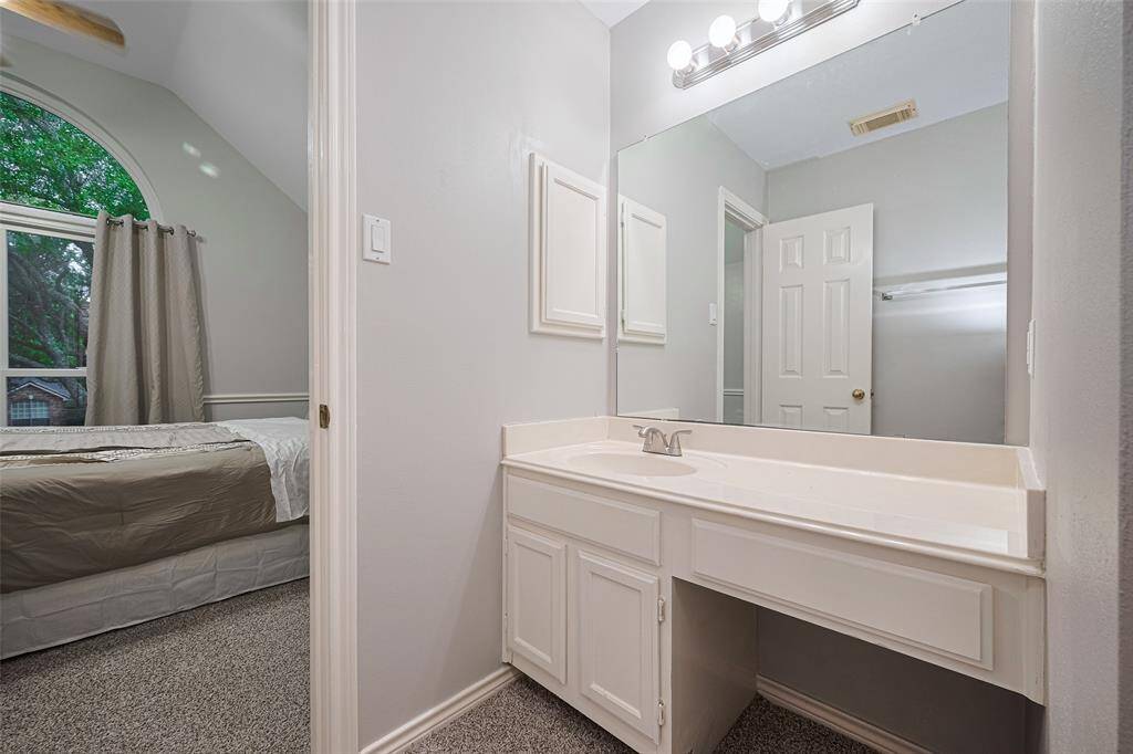 One of the two full bathrooms upstairs -- this one connects to the guest bedroom  and is also convenient to the gameroom