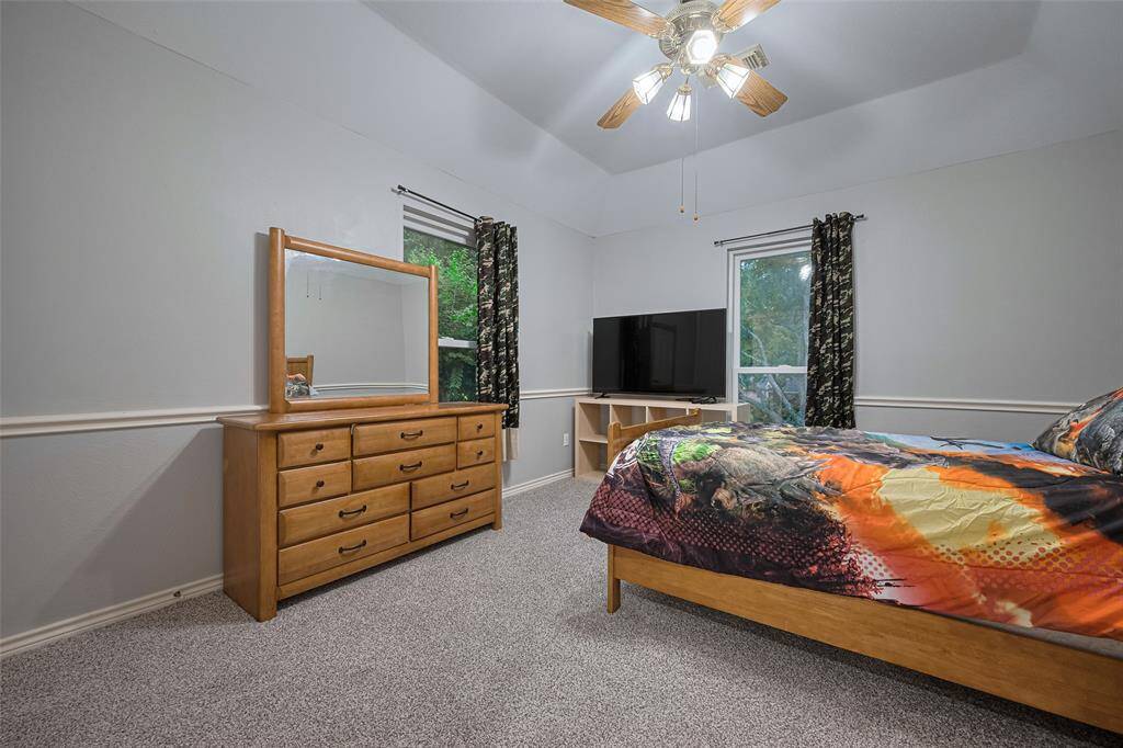 Another bedroom up with 2 corner windows, coffered ceilings, new carpet and spacious closet.