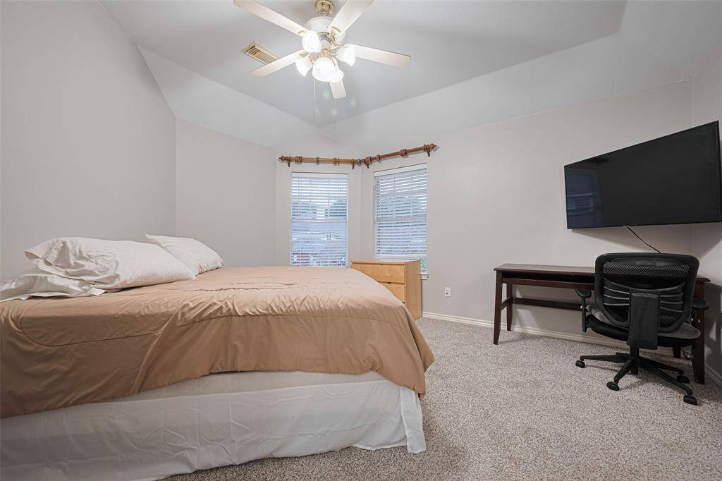 The 3rd of the upstairs bedrooms, corner windows, and new carpet!