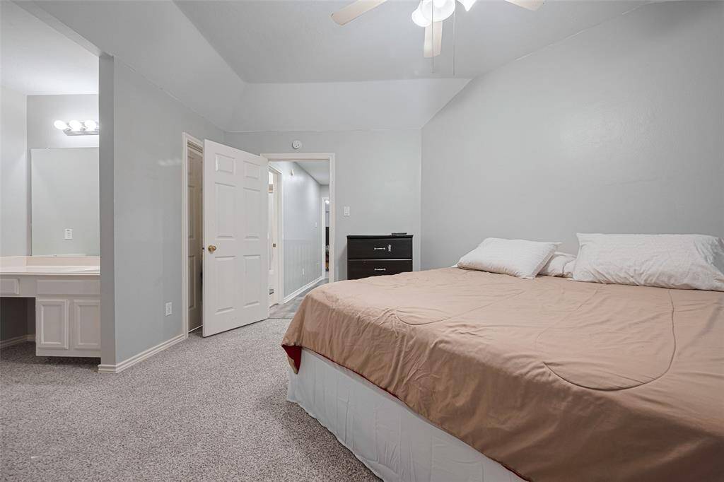 Notice the separate vanity area adjacent to this bedroom