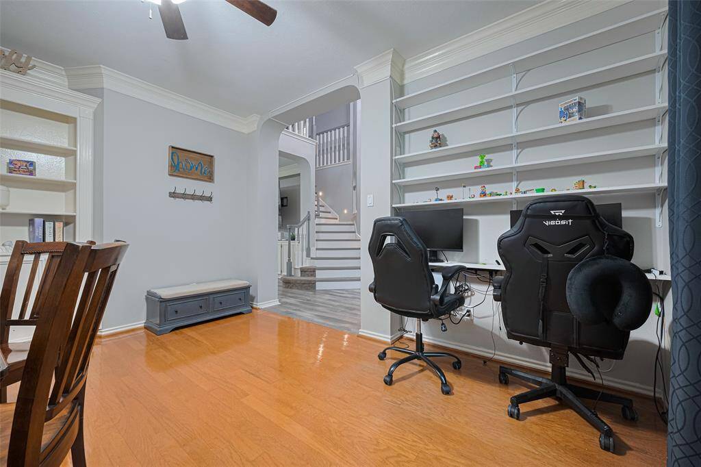 The office also boasts another set of built-ins along the front wall -- currently being used by this family as a video playstation.