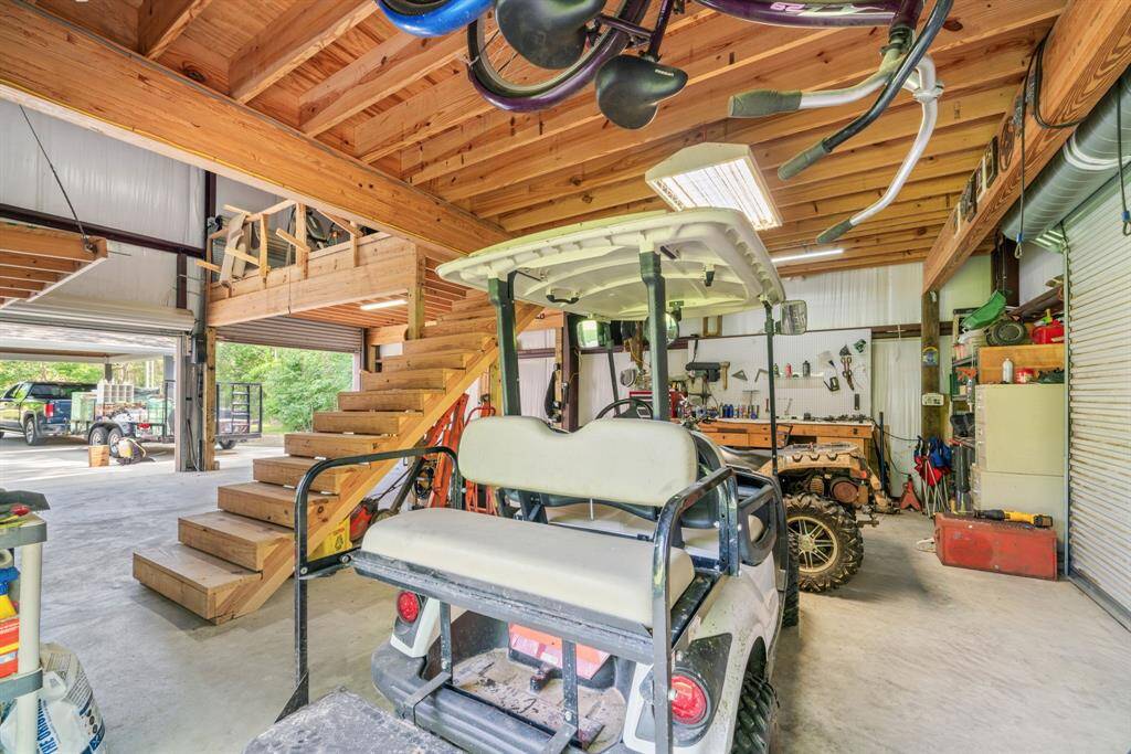 Multiple roll-up doors offer easy access, while abundant storage and workspace make this a true multifunctional area.